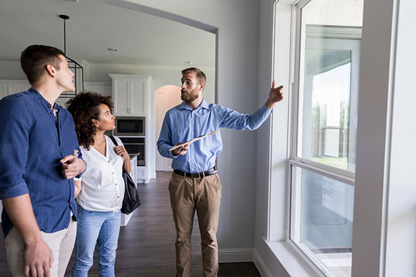 EcoView consultant discussing window replacement options with a homeowner